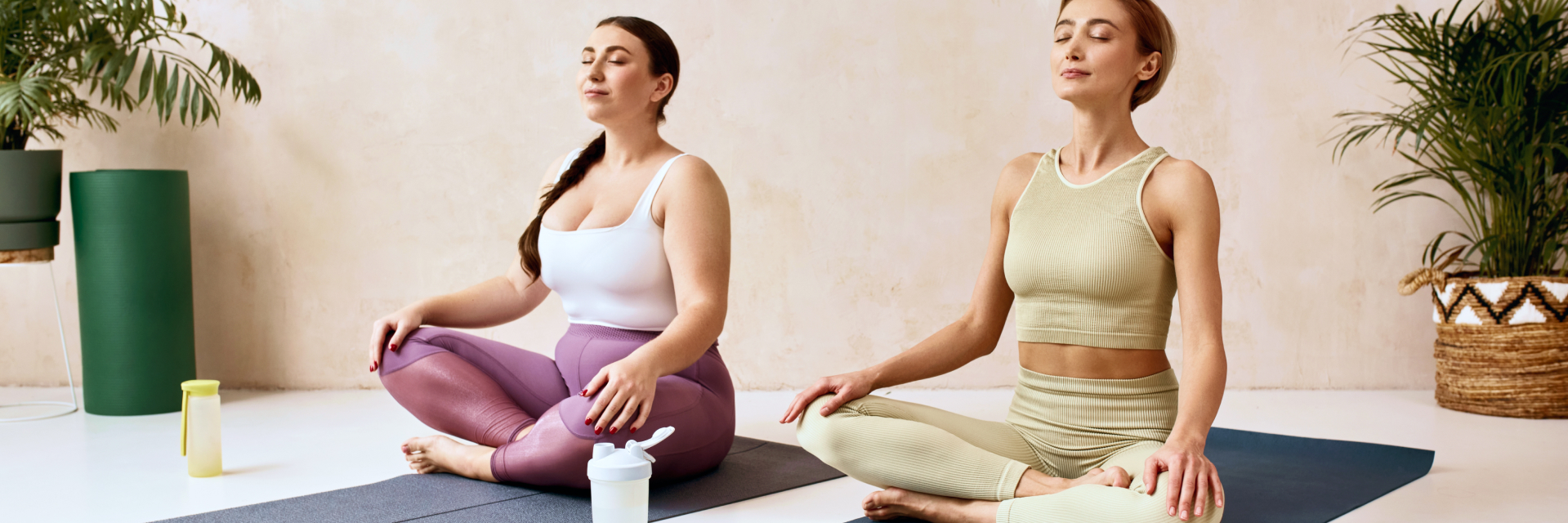 A photo of two women meditating.