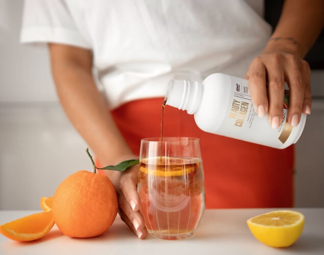 A girl is preparing Beauty Collagen for drinking