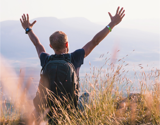 A photo of a man on a hill.