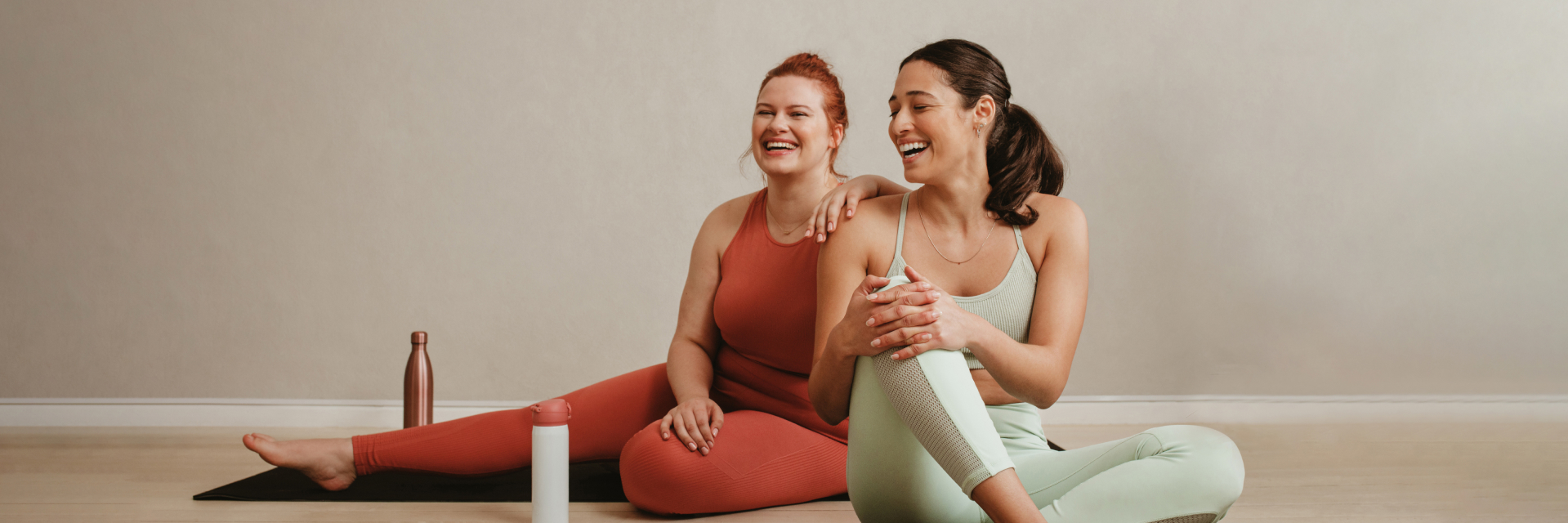 A photo of two smiling women.