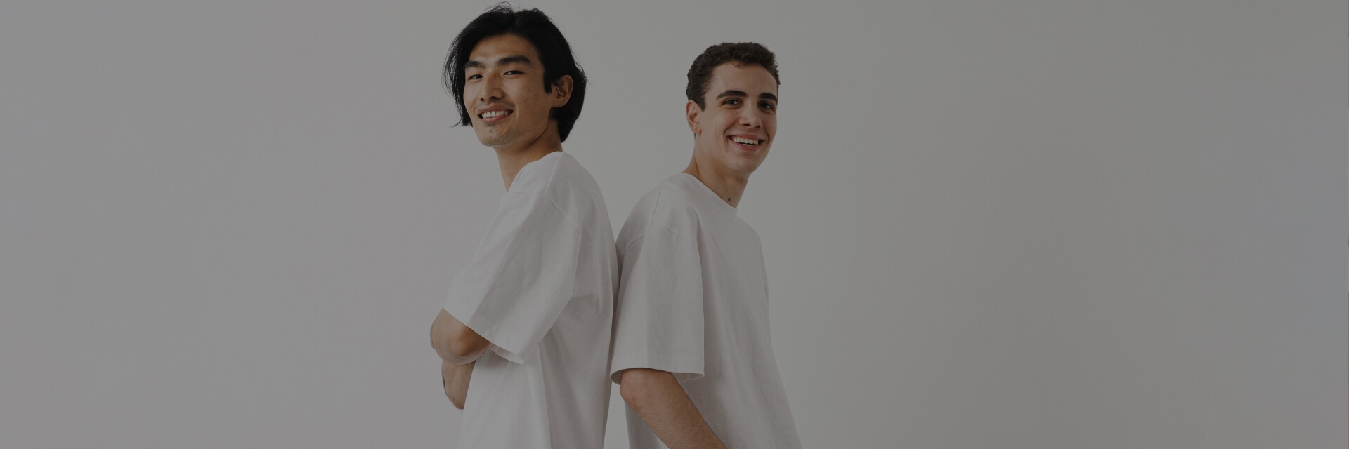 Two happy men in white T-shirts