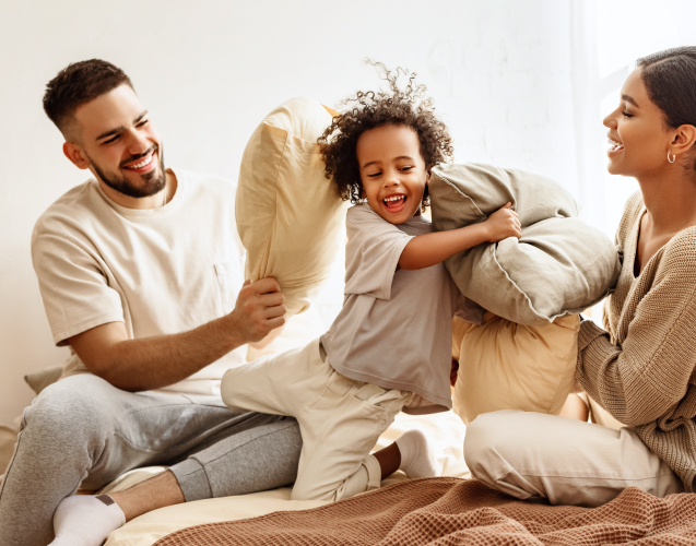 A photo of a family playing.